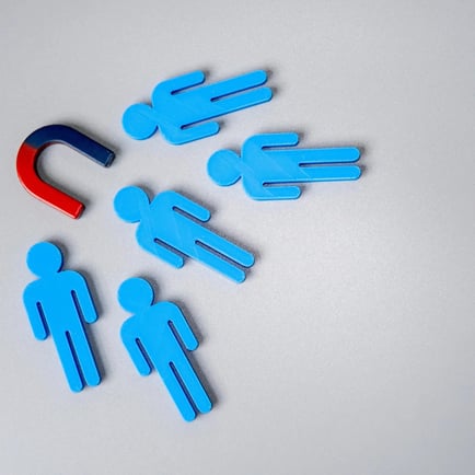 Magnet attracting blue people outlines