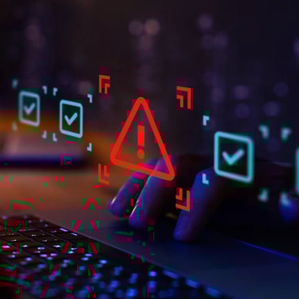 Computer screen showing three blue check marks in boxes and one red exclamation point in a triangle