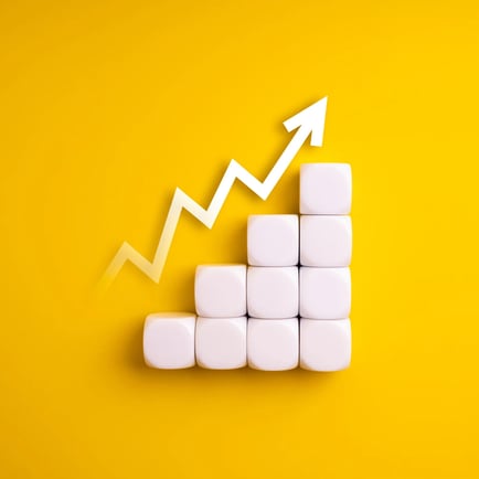 Stack of white blocks in an upward height with an increasing zigzag arrow o n a yellow background