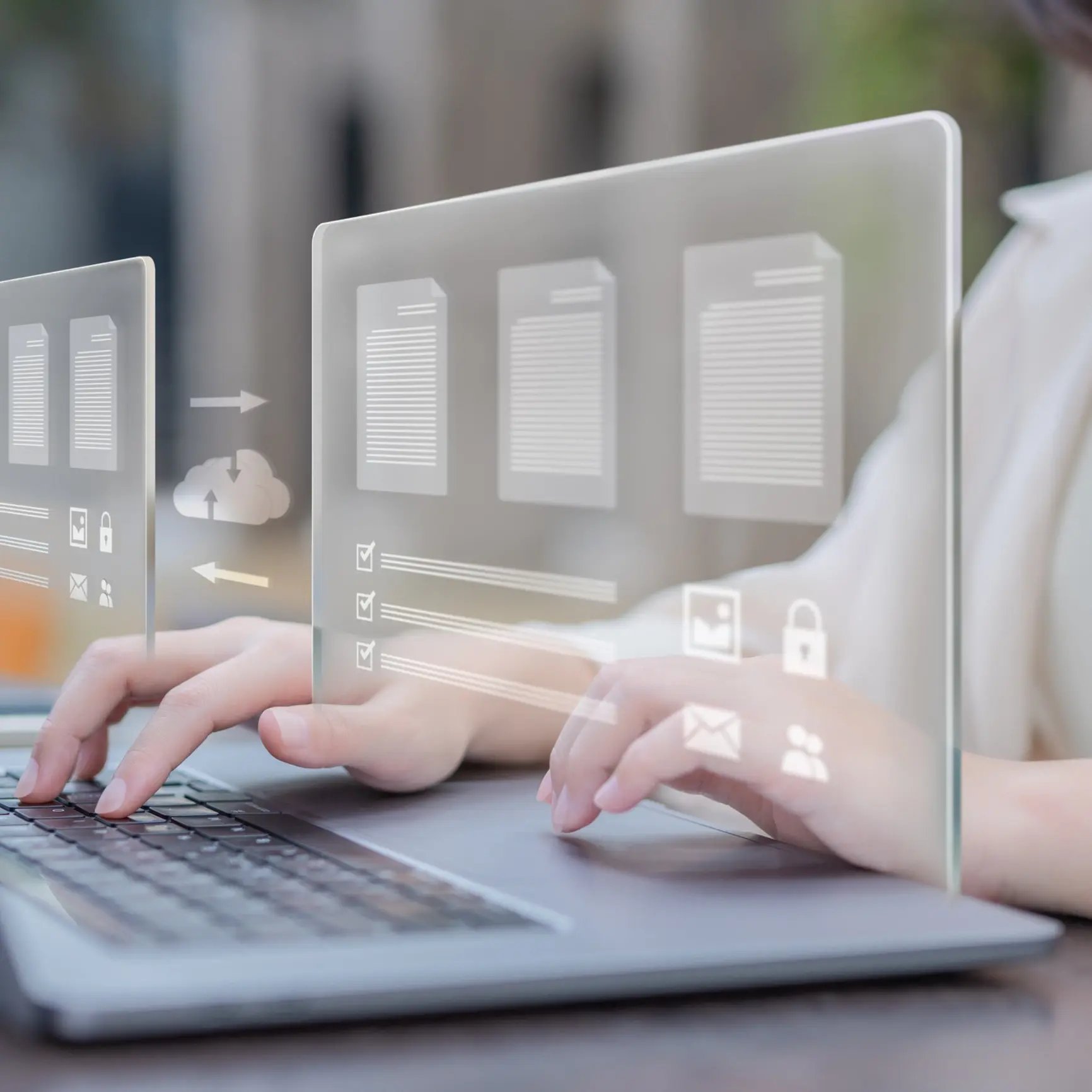 Hands typing on a laptop with digital icons representing platform migration and data transfer.