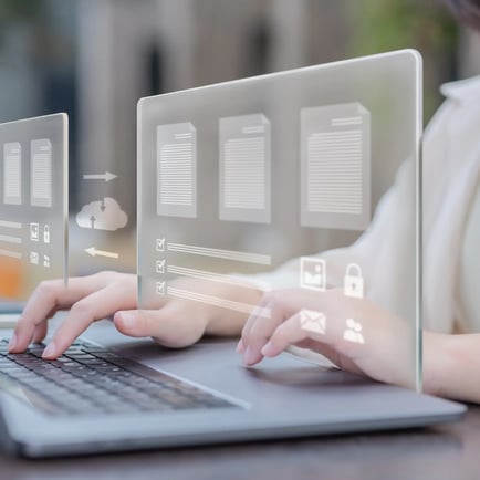 Hands typing on a laptop with digital icons representing platform migration and data transfer.
